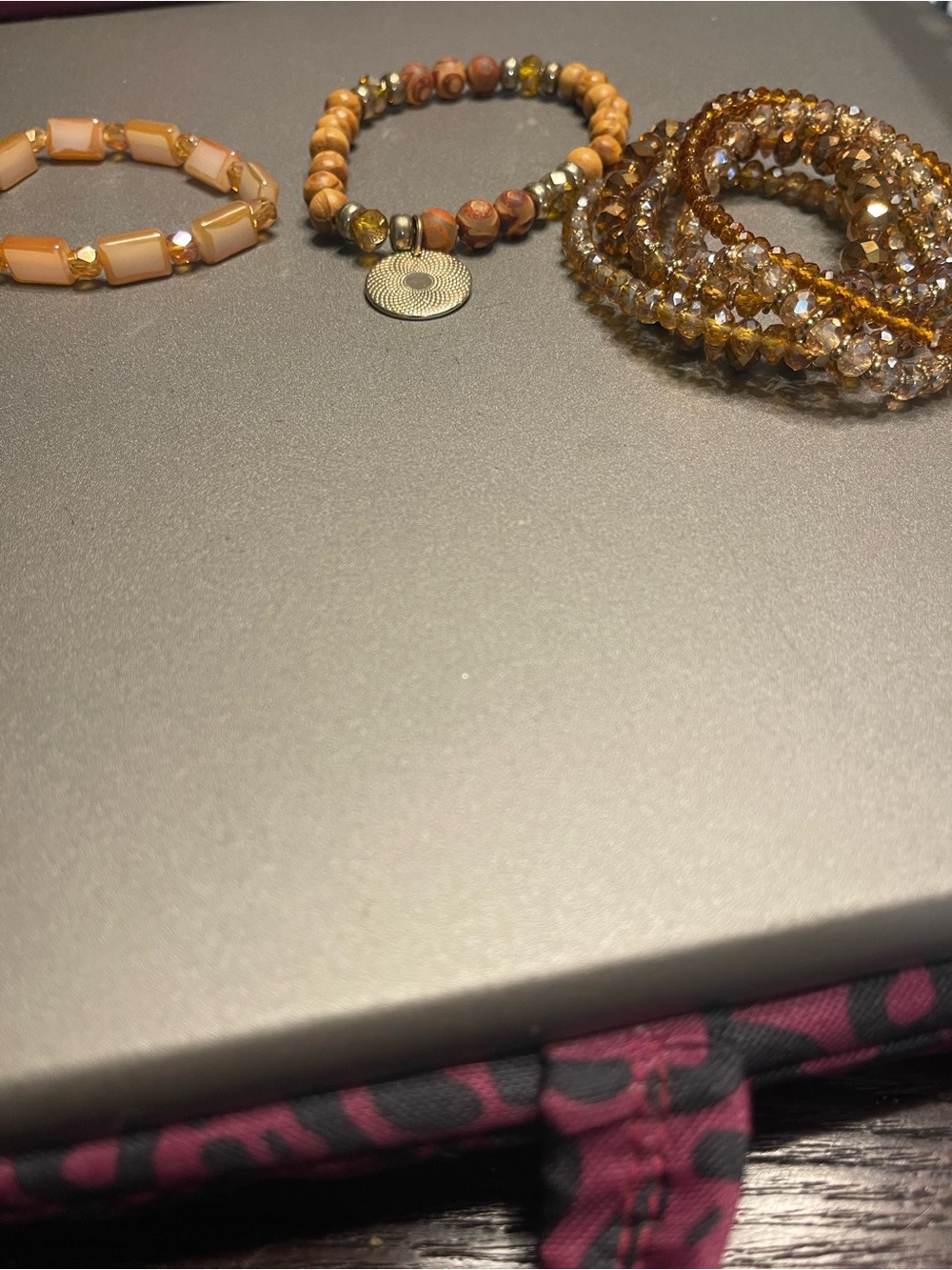 Stack of Peach and Amber Beaded Bracelets